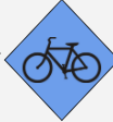 File:Timonocitian Cyclists Ahead Sign.png