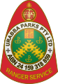 A red badge featuring the insignia of the Urabbaparcensian Defence Service