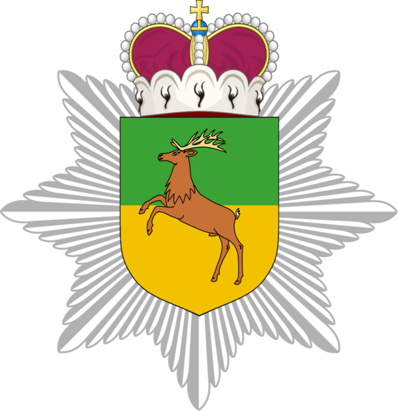 File:Caudonia police badge.png