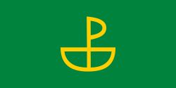 A green flag with the Urabbaparcensian Cross in the centre
