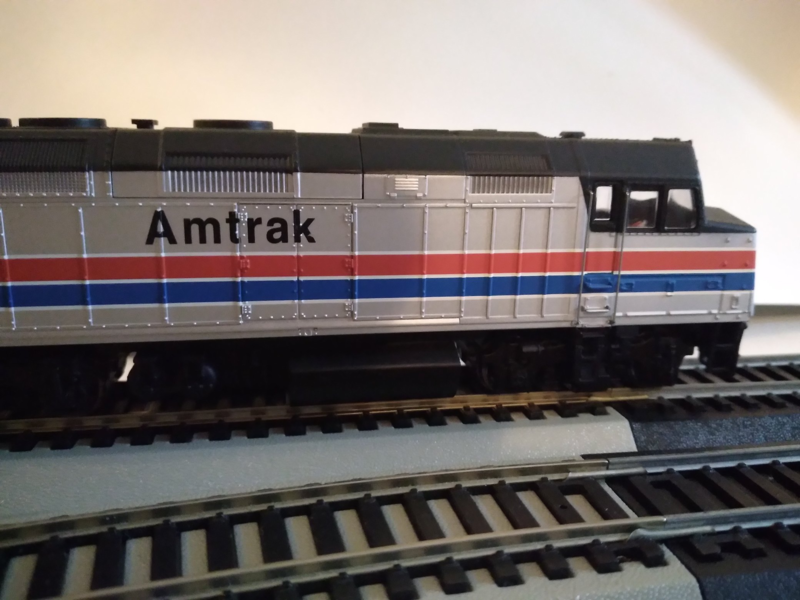 File:Former Amtrak F40PH -243 pushing train -1732.png
