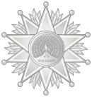 Heraldic badge of the Commander 1st Class grade.