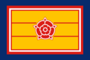The flag of the Worker's Freedom Party of Zeprana is a blue-red-yellow flag with the flower of the party in the middle.